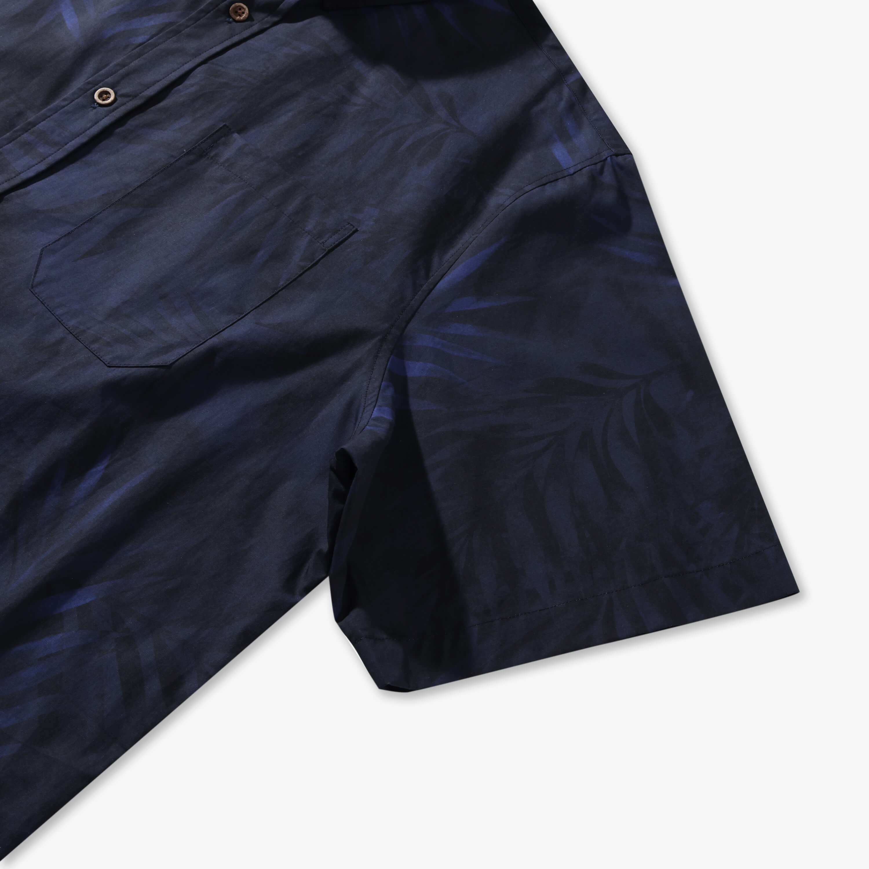 Ink blue Shadow Palm shirt with a print-matched chest pocket and understated palm-leaf pattern